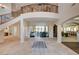 Grand foyer with soaring ceilings, curved staircase, iron railings, and seamless access to living areas at 2 Camino Barcelona Pl, Henderson, NV 89011