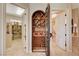 Hallway featuring a wine cellar and access to the pantry and bathroom at 2 Camino Barcelona Pl, Henderson, NV 89011