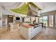 Open-concept kitchen with center island, granite countertops, a large range, and an eating nook at 2 Camino Barcelona Pl, Henderson, NV 89011