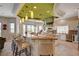 Chef's kitchen featuring a large island, granite countertops, and stainless steel appliances at 2 Camino Barcelona Pl, Henderson, NV 89011