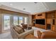 Comfortable living room area with built in storage, plenty of natural light, and balcony access at 2 Camino Barcelona Pl, Henderson, NV 89011