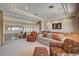 Elegant living room with a tray ceiling, a built-in entertainment center, and great natural light at 2 Camino Barcelona Pl, Henderson, NV 89011