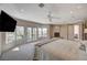 This main bedroom features a balcony, fireplace, and plush carpeting, perfect for relaxation at 2 Camino Barcelona Pl, Henderson, NV 89011