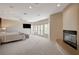 Spacious main bedroom boasts a fireplace, balcony access, and plush carpeting for added comfort at 2 Camino Barcelona Pl, Henderson, NV 89011