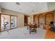 Spacious home office with custom built-ins and a view of the outdoor patio at 2 Camino Barcelona Pl, Henderson, NV 89011