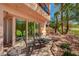 Cozy patio seating with views of the landscaped yard and a glimpse of the golf course at 2 Camino Barcelona Pl, Henderson, NV 89011