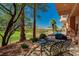 Relaxing outdoor seating area featuring wrought iron furniture and picturesque golf course views at 2 Camino Barcelona Pl, Henderson, NV 89011