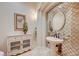 Stylish powder room with an decorative mirror and vessel sink at 2 Camino Barcelona Pl, Henderson, NV 89011