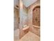 This luxurious walk-in shower features a built-in seat and stylish tile work, creating a spa-like retreat at 2 Camino Barcelona Pl, Henderson, NV 89011