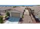 View of a house featuring desert landscaping, tile roof, and convenient RV parking at 2351 Thornwood Castle Dr, Laughlin, NV 89029