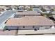 This aerial view shows a home with a backyard pool and easy-to-maintain desert landscaping at 2351 Thornwood Castle Dr, Laughlin, NV 89029