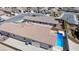 This aerial view shows a home with a pool and easy-to-maintain desert landscaping at 2351 Thornwood Castle Dr, Laughlin, NV 89029