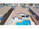 This private backyard features a pool, a covered patio, and easy to maintain landscaping at 2351 Thornwood Castle Dr, Laughlin, NV 89029