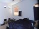 Bright bedroom with a large window offering natural light, creating a comfortable space at 2351 Thornwood Castle Dr, Laughlin, NV 89029