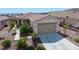 Charming single-story home with tile roof, desert landscaping, and inviting curb appeal at 2351 Thornwood Castle Dr, Laughlin, NV 89029