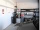 Spacious garage providing secure parking and storage solutions with installed shelving at 2351 Thornwood Castle Dr, Laughlin, NV 89029