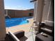 Inviting pool area with lounge seating offering relaxation and scenic views at 2351 Thornwood Castle Dr, Laughlin, NV 89029