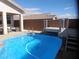 Sparkling pool features a diving platform and convenient access ladder for enjoying summer days at 2351 Thornwood Castle Dr, Laughlin, NV 89029