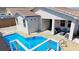 Backyard oasis featuring a refreshing pool, covered patio, and private outdoor space at 2351 Thornwood Castle Dr, Laughlin, NV 89029