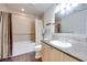 Bright bathroom featuring a tub-shower, vanity with sink, and modern fixtures at 2455 W Serene Ave # 603, Las Vegas, NV 89123