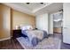 A serene bedroom with a ceiling fan and access to the ensuite bathroom at 2455 W Serene Ave # 603, Las Vegas, NV 89123