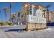 Elegant Boca Raton condominiums featuring lush landscaping, and a grand entrance sign at 2455 W Serene Ave # 603, Las Vegas, NV 89123