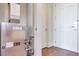 A hallway with tile floors features a furnace and an exterior door at 2455 W Serene Ave # 603, Las Vegas, NV 89123