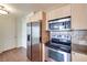 Kitchen features stainless appliances, tile backsplash, and tile floor, with white doors visible at 2455 W Serene Ave # 603, Las Vegas, NV 89123