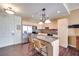 Updated kitchen featuring stainless steel appliances, a granite island, and a tiled floor at 2455 W Serene Ave # 603, Las Vegas, NV 89123