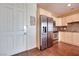 Bright kitchen with stainless steel appliances, and tile backsplash, located adjacent to the front entrance at 2455 W Serene Ave # 603, Las Vegas, NV 89123