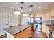 Bright kitchen featuring stainless appliances, granite island, lots of cabinets and tiled floor at 2455 W Serene Ave # 603, Las Vegas, NV 89123