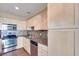 Bright kitchen with stainless steel appliances and tile backsplash, next to light colored wood cabinets at 2455 W Serene Ave # 603, Las Vegas, NV 89123