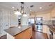 Bright kitchen with stainless appliances, granite island, and tile backsplash, plus lots of storage at 2455 W Serene Ave # 603, Las Vegas, NV 89123