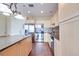 Bright kitchen features an island, stainless steel appliances, tile backsplash, and light cabinets at 2455 W Serene Ave # 603, Las Vegas, NV 89123