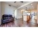 Spacious living room with wood floors, sofa and view of kitchen with island at 2455 W Serene Ave # 603, Las Vegas, NV 89123