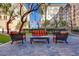 Outdoor seating area on paved patio, with comfortable furniture, greenery, and privacy at 2455 W Serene Ave # 603, Las Vegas, NV 89123
