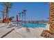 Community pool with clear blue water and lounge chairs, perfect for relaxation at 2455 W Serene Ave # 603, Las Vegas, NV 89123