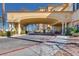The porte cochere offers shaded entry with manicured landscaping and tiled surface at 2455 W Serene Ave # 603, Las Vegas, NV 89123