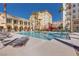 The Community pool is a great amenity with poolside seating and desert landscaping at 2455 W Serene Ave # 603, Las Vegas, NV 89123