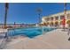 Resort-style swimming pool with lounge chairs and umbrellas for relaxation at 2455 W Serene Ave # 603, Las Vegas, NV 89123