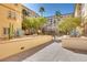 Walkway with desert landscaping and mature trees offers a tranquil pathway through community at 2455 W Serene Ave # 603, Las Vegas, NV 89123