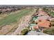 Stunning aerial view of the backyard, pool, and golf course at 2600 Cervino Cir, Henderson, NV 89052