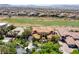 Expansive aerial view of a luxury home near a golf course and mountains at 2600 Cervino Cir, Henderson, NV 89052