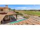 Luxury home featuring an inviting pool, manicured landscaping, and serene golf course views at 2600 Cervino Cir, Henderson, NV 89052