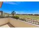 A beautiful balcony view of a green golf course with scattered houses under a bright blue sky at 2600 Cervino Cir, Henderson, NV 89052