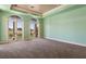 A large bedroom with access to the outdoors and a golf course view at 2600 Cervino Cir, Henderson, NV 89052