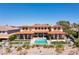 Beautiful backyard of estate home with pool, manicured landscaping, and desert views at 2600 Cervino Cir, Henderson, NV 89052