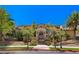 Elegant home featuring detailed wrought iron entry gate and manicured landscaping, offering luxurious curb appeal at 2600 Cervino Cir, Henderson, NV 89052