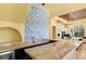 Gourmet kitchen boasts a large center island, granite countertops, custom cabinetry and modern appliances at 2600 Cervino Cir, Henderson, NV 89052