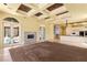 Spacious living area featuring a fireplace, many windows, and an open layout at 2600 Cervino Cir, Henderson, NV 89052